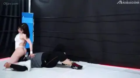 Asian Couple in Wrestling Ring Encounter