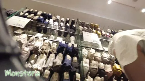 Asian Girl in Skirt Bending Over in Clothing Store