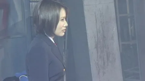 Uniformed Women Wrestling and Posing