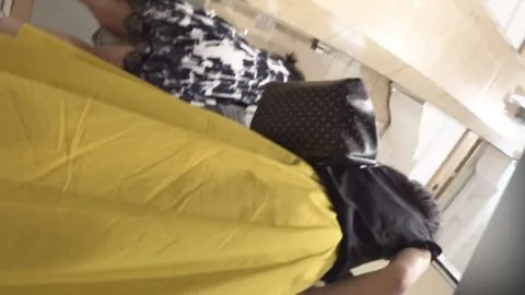 Brunette tries on clothes in store