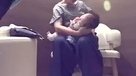 Asian Lesbians Breastfeeding in Nursing Room