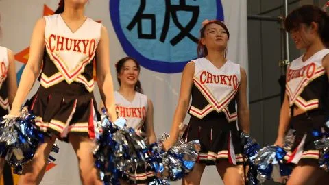 Asian Teen Cheerleaders Perform on Stage