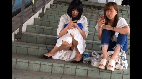 Asian Lesbians Kissing on Staircase