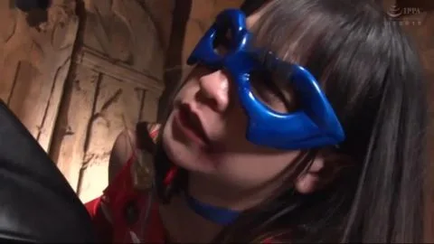 Asian cosplayer in red and blue costume with masked man