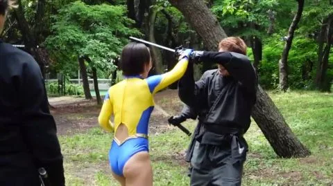 Asian Performers Engage in Fantasy Sword Fights