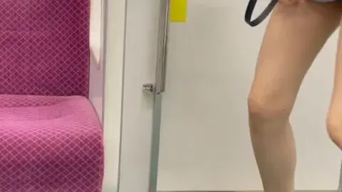 Asian Girl in Denim Shorts on Train