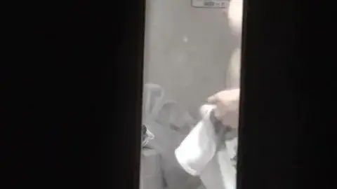 Asian Girl Undressing in Bathroom