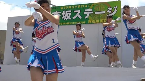 Asian Teens Dance in Uniforms on Stage