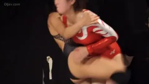 Asian Lesbians Wrestling on Bed