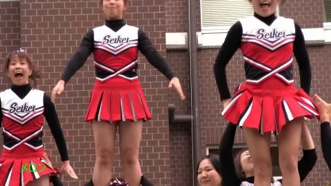 Asian Teen Cheerleaders Outdoor Stunts