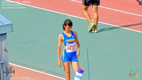 Asian Athletic Girl Running on Track
