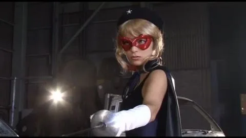 Blonde in Blue Bodysuit and Red Mask