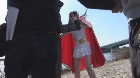 Asian Performers in Cosplay at the Beach