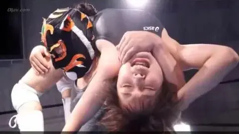 Wrestling Match Between Masked Male and Female