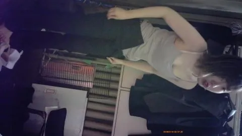 Caucasian Woman in Cage and Bondage Scene