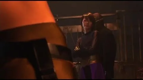 Asian Women in Black Outfits Industrial Setting