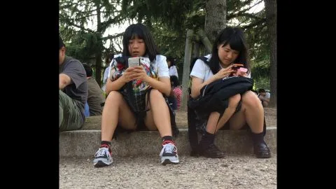 Asian Schoolgirls in Uniform Flirt on Steps