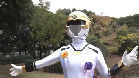 Asian Performer in Silver Costume