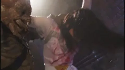 Asian woman in bloody outfit restrained and manipulated