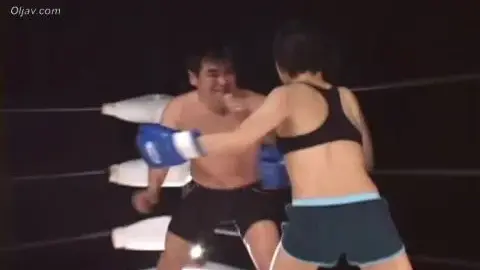 Asian Couple Boxing in Ring