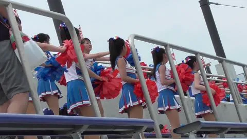 Asian Teen Cheerleaders with Pom-Poms
