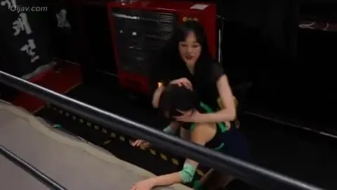 Asian Women Wrestling in Ring