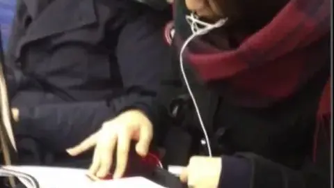 Asian Couple on Public Transportation