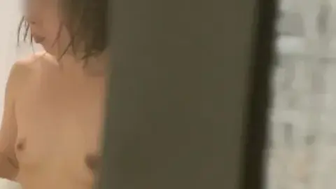 Dark-Haired Girl Bathing and Grooming