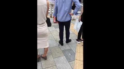 Asian Women Walking on Sidewalk