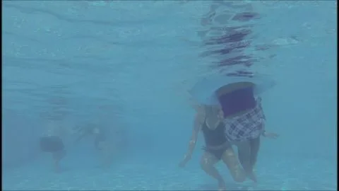 Blonde and Brunette Babes in Swimsuits Underwater
