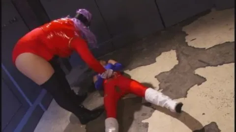 Asian Performers in Red Outfits Engage in Restraint