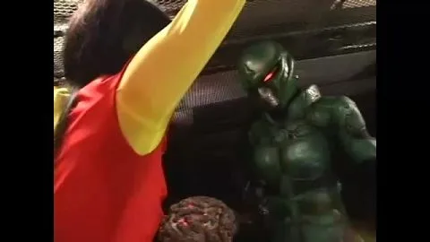 Red Costumed Female vs Alien in Futuristic Setting