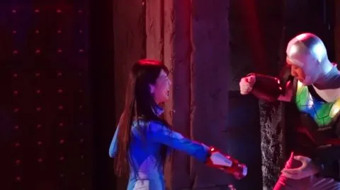 Asian Performers in Bodysuits and Metallic Costume