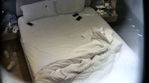 Intimate Embrace and Phone Play in Bed