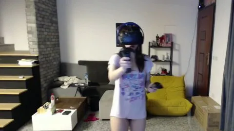 Asian Couple Wearing VR Headset in Living Room