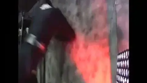 Asian Men Wrestling in Industrial Setting