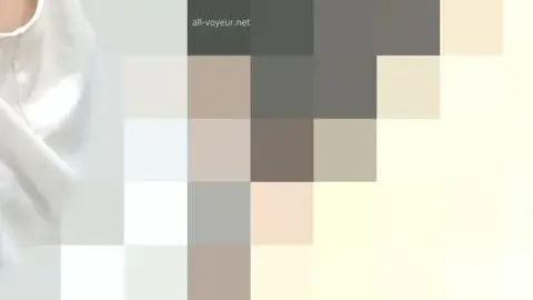 Slim Caucasian Woman Undressing in Intimate Setting