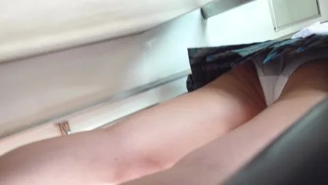 Slim Caucasian Woman in Plaid Shirt on Train