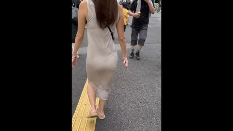 Asian Girl in Beige Dress on Street