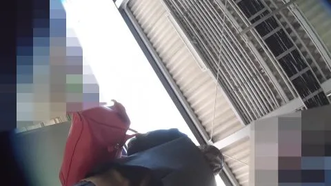 Asian teen in black skirt and stockings on train