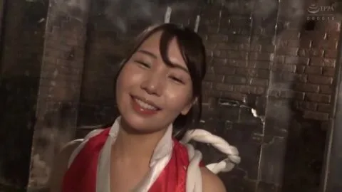Asian Girl in Red and White Costume in Industrial Setting