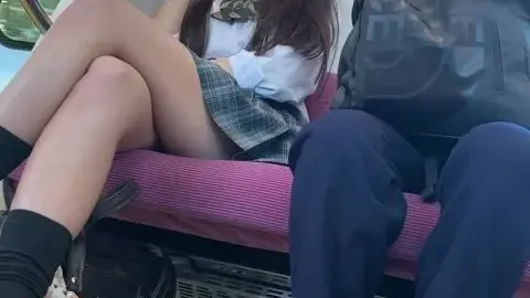 Asian Couple on Train with Face Masks