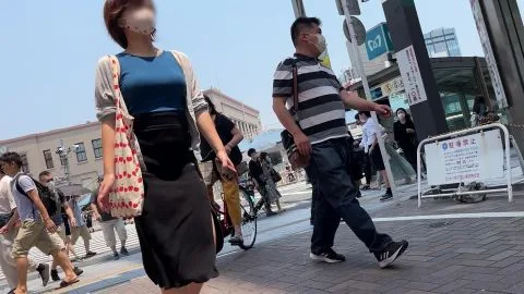Asian Girl in Blue Top and Black Skirt on Street