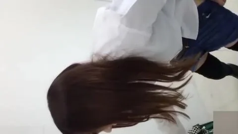Asian girl defecating in bathroom