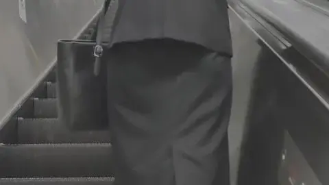 Blonde Asian Businesswoman in Black Suit