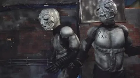 Asian Performers in Fetish Costumes Engage in BDSM Scenes