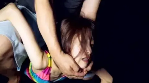 Asian Couple Engages in Intense Intimacy