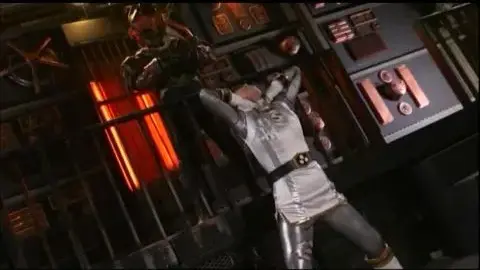 Asian Girl in Silver Costume in Futuristic Room