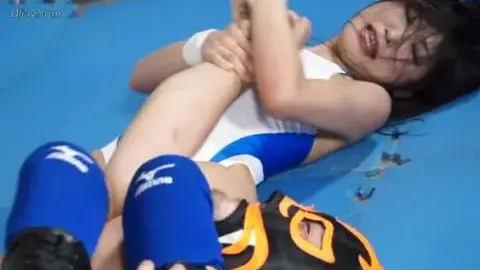 Asian Wrestlers Engage in Intense Match