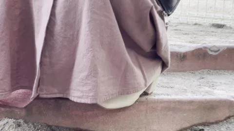 Asian Girl Plays in Sandbox